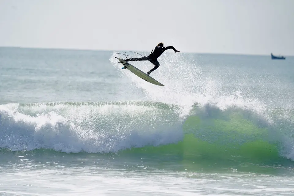 Surfer riding a wave off the Moroccan coast
