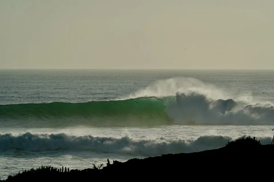 Powerful Atlantic curl breaking in crystal clear ocean light