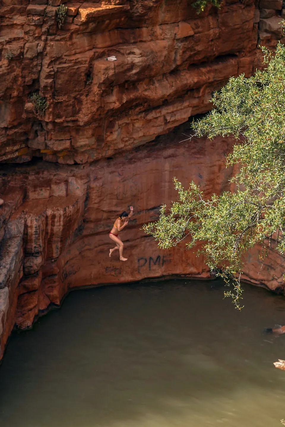 Cliff jump into a natural pool in the Moroccan mountains