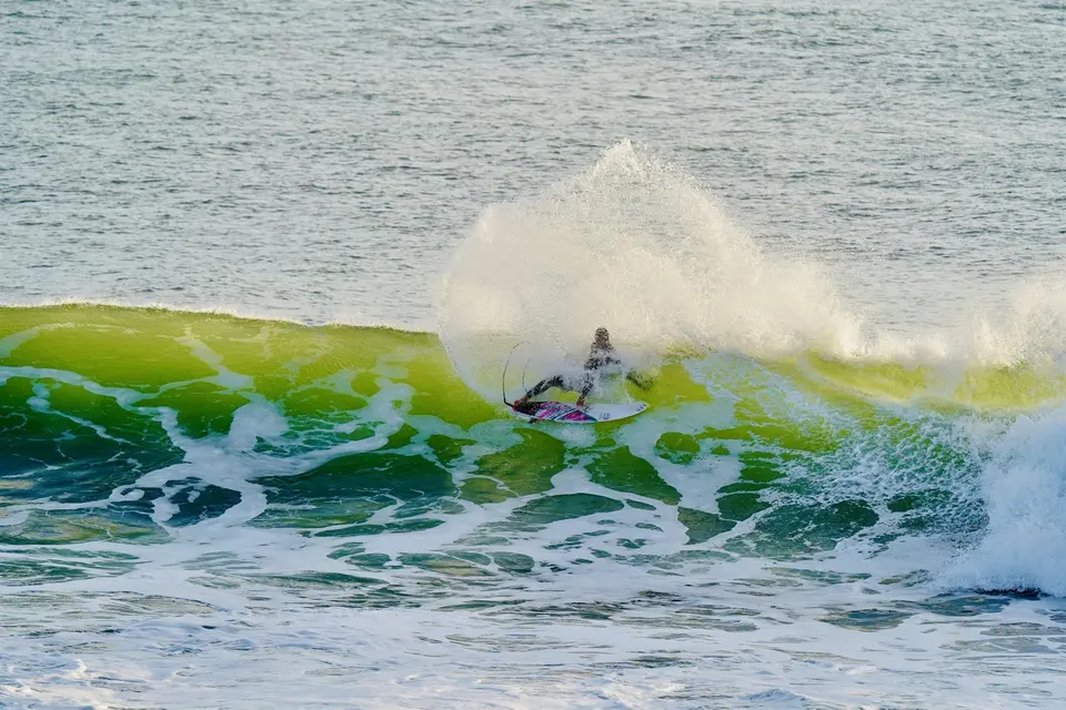 Surfer dropping in on a heavy Atlantic winter swell